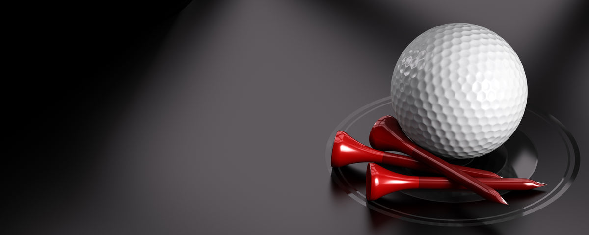 Golf ball and red tees