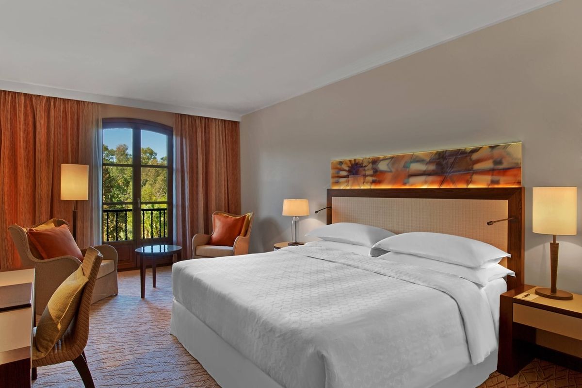 Bedroom with a large bed at Sheraton Mallorca Arabella Golf Hotel