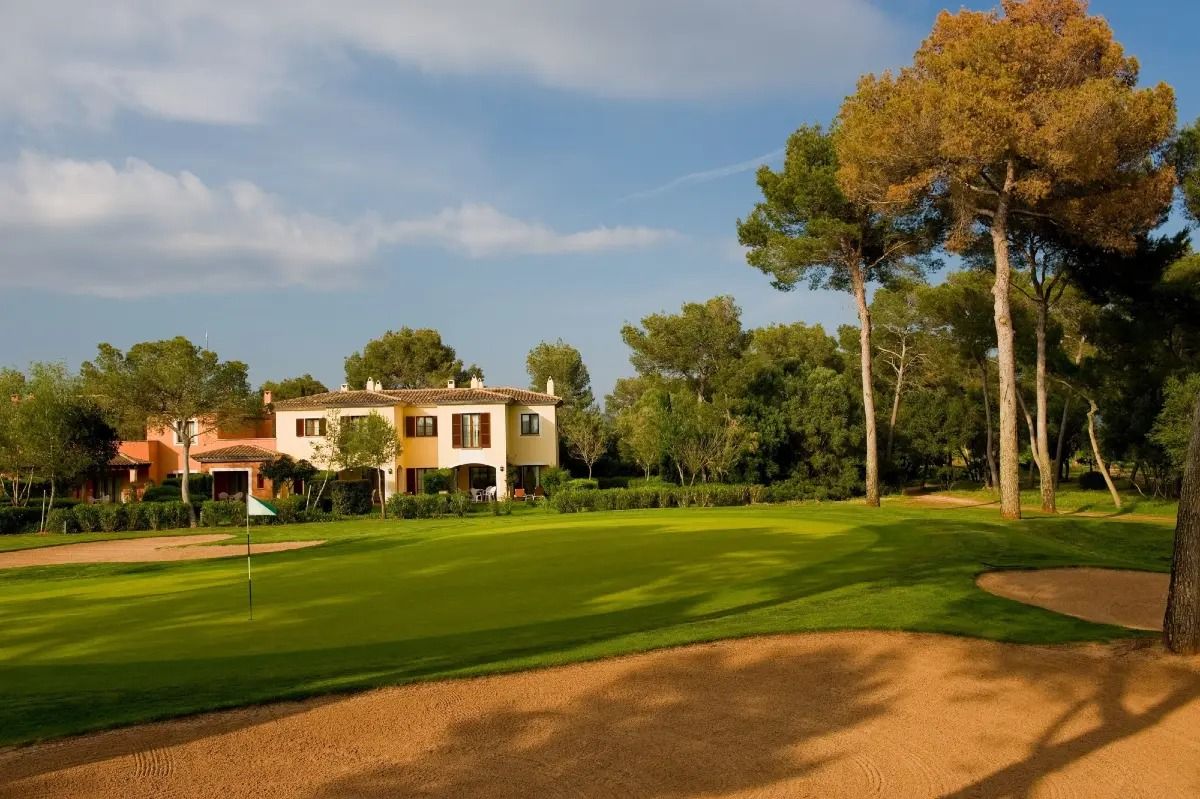 Bunker with a villa behind the fairway at Son Antem East golf course, Mallorca