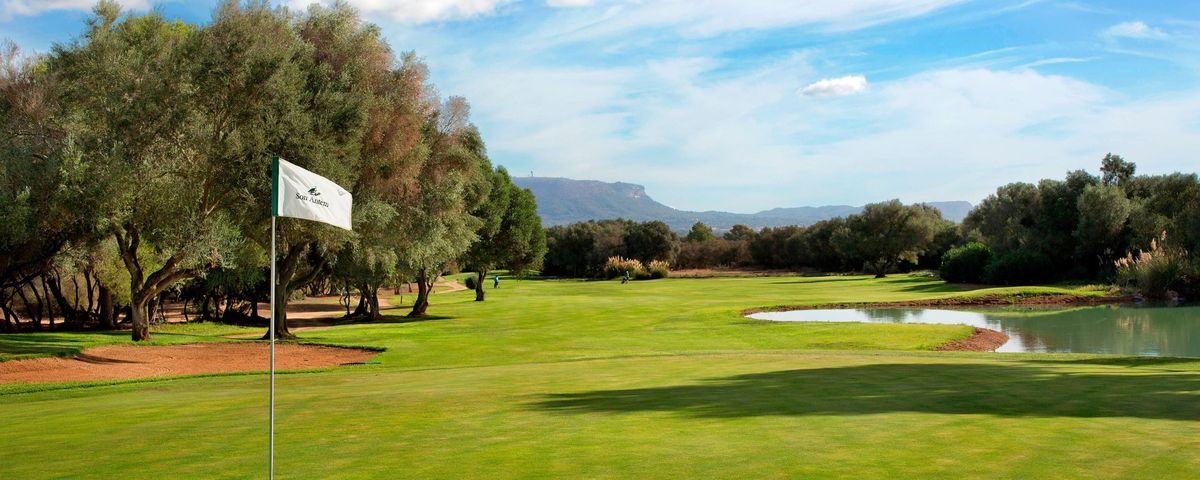 Fairway with a pin flag and mountain view at Son Antem East golf course, Mallorca