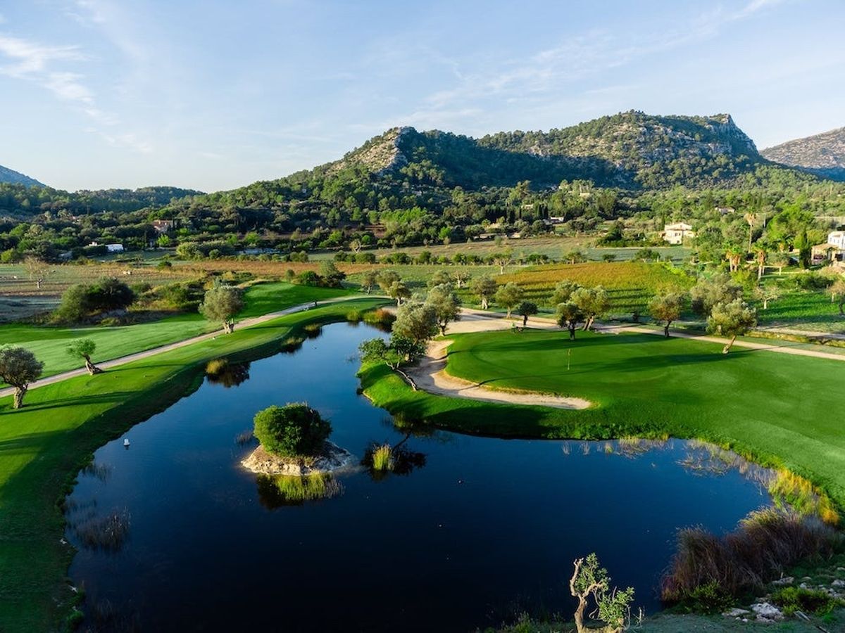 Lake with a small island and mountain view at Golf Pollensa, Mallorca