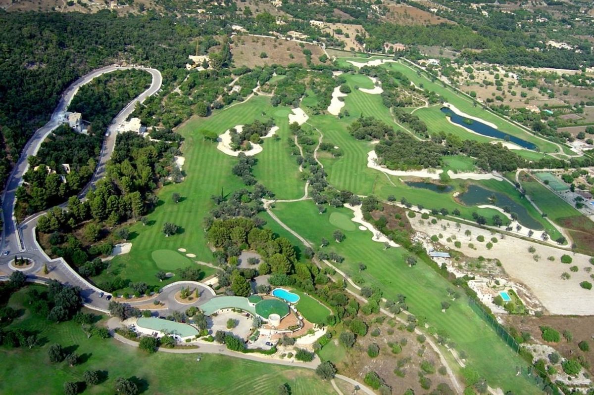 Aerial view of the fairways and resort pool at Golf Pollensa, Mallorca