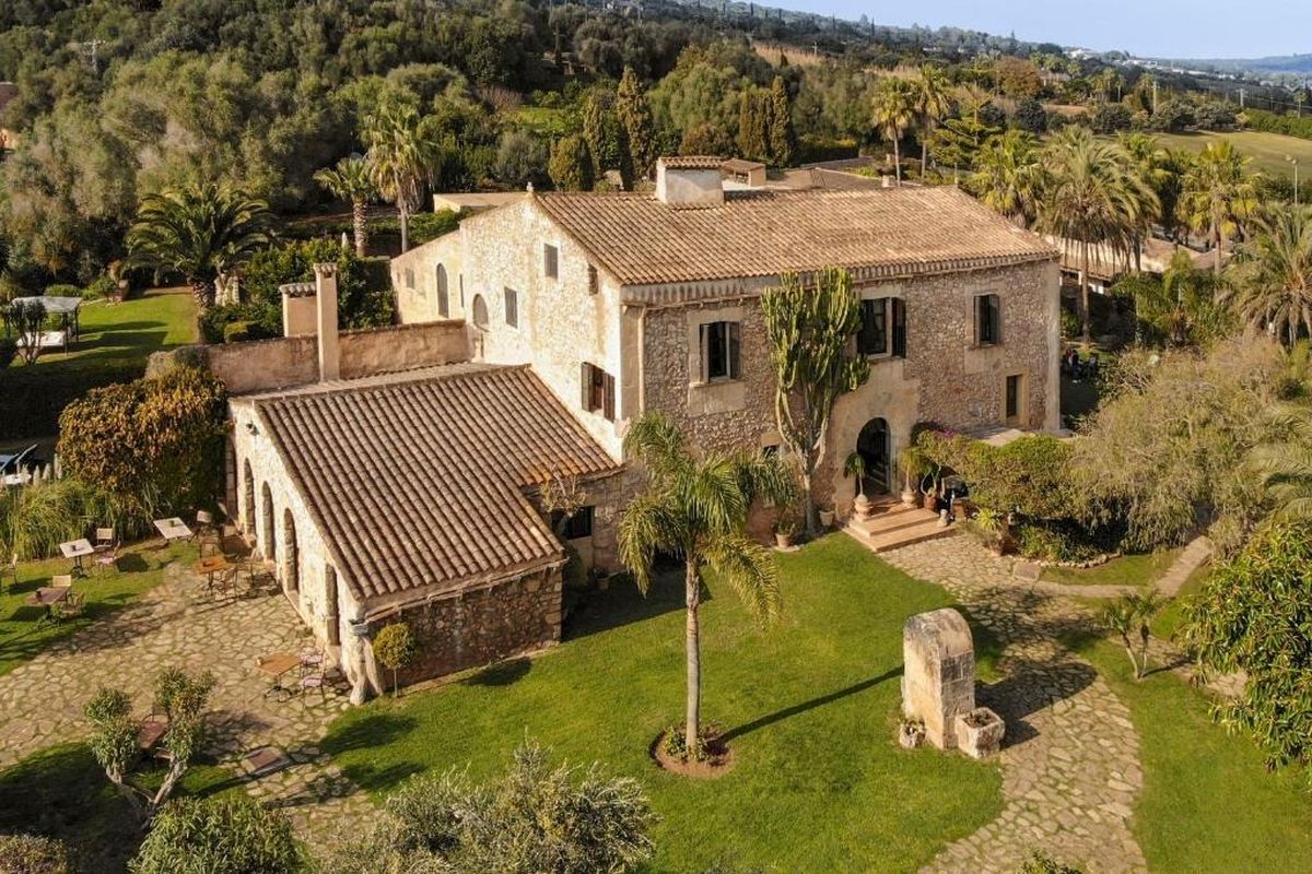 Stone finca hotel with a tiled roof at La Reserva Rotana, Mallorca