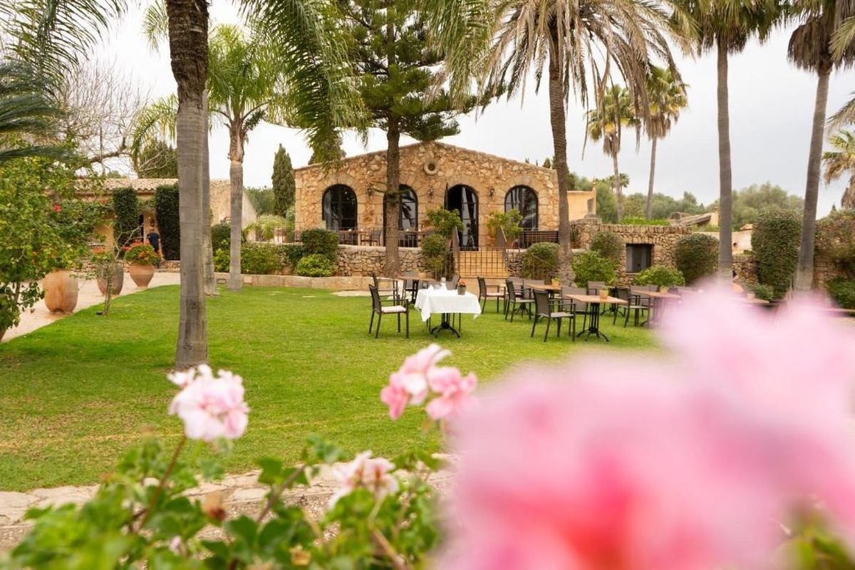 Garden terrace with flowers at the finca at La Reserva Rotana, Mallorca