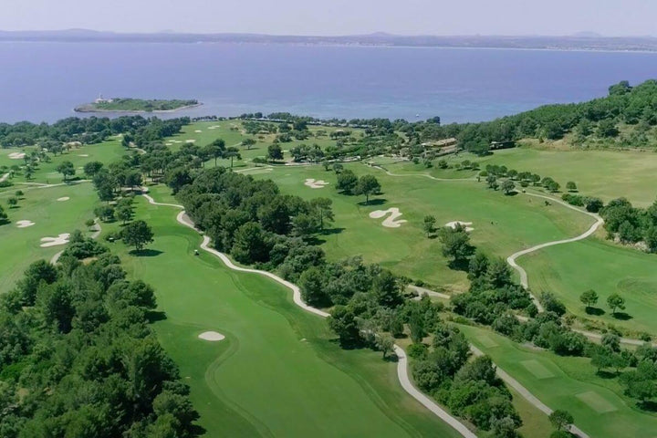 Rent2Play.Golf Alcanada 18-hole green fee at a scenic golf course, featuring lush fairways and greens for a memorable round of golf.